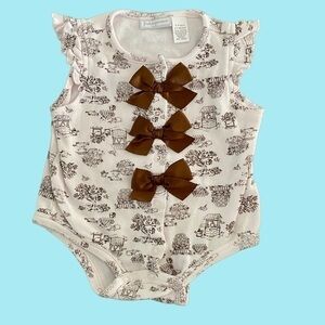 First Impressions onesie